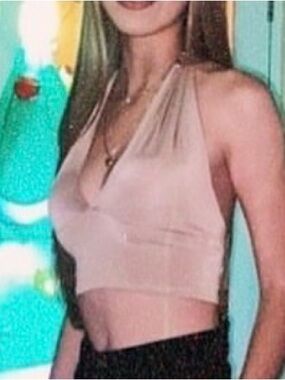 Crop Top fastens at the neck. Color: Nude. Size: XS